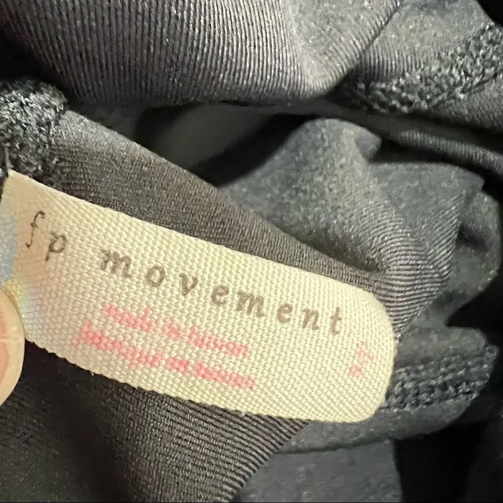 Free People Movement Ascend Black Leggings with ribbon and cutout details